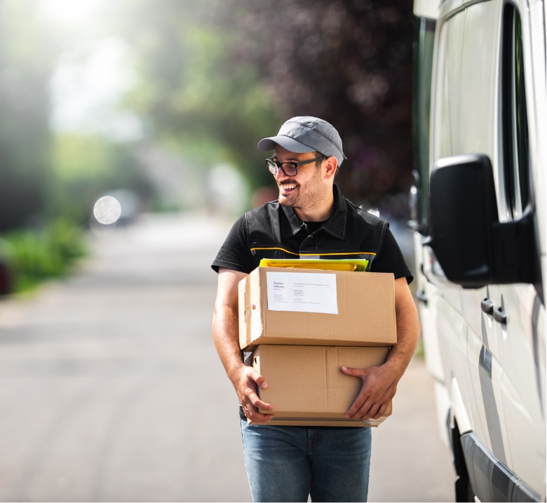smiling man carrying packages